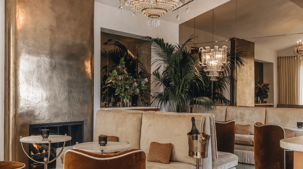 Velvet, glass, and polished nickel come together to create a refined sense of luxury within the lounge space at Caviar Kaspia West Hollywood, designed by Night Palm.