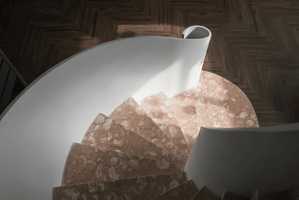 Warm-toned natural wood, cool veined stone, and fluid curved forms come together in harmony, creating a layered experience that engages both sight and touch.